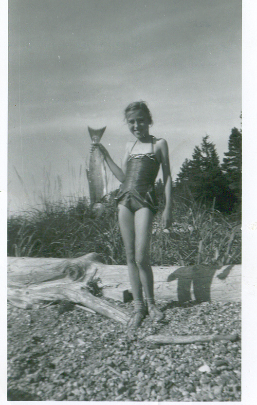 Twelve-year old Nancy with her five-pound salmon, emulating her great-grandfather